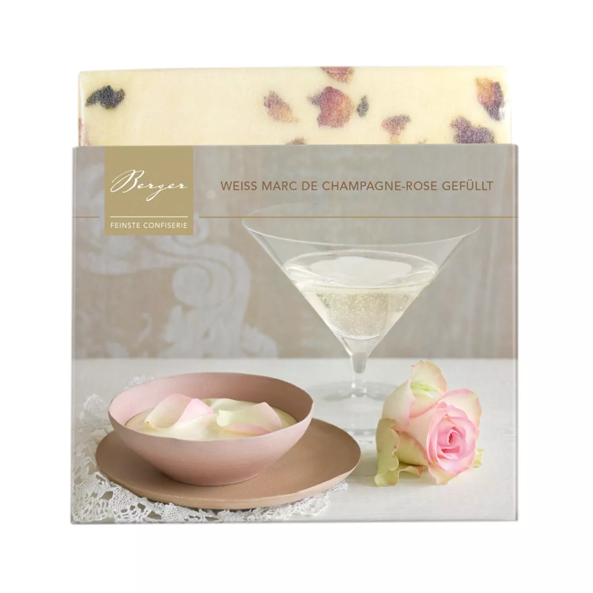 Berger Schokolade Weiss Marc de Champagne-Rose gefüllt 100g Eine cremig-elegante Marc-de-Champagne-Ganache mit Rosenöl verfeinert findet sich in weißer Bio-Schokolade. Bestreut mit Rosenblüten.